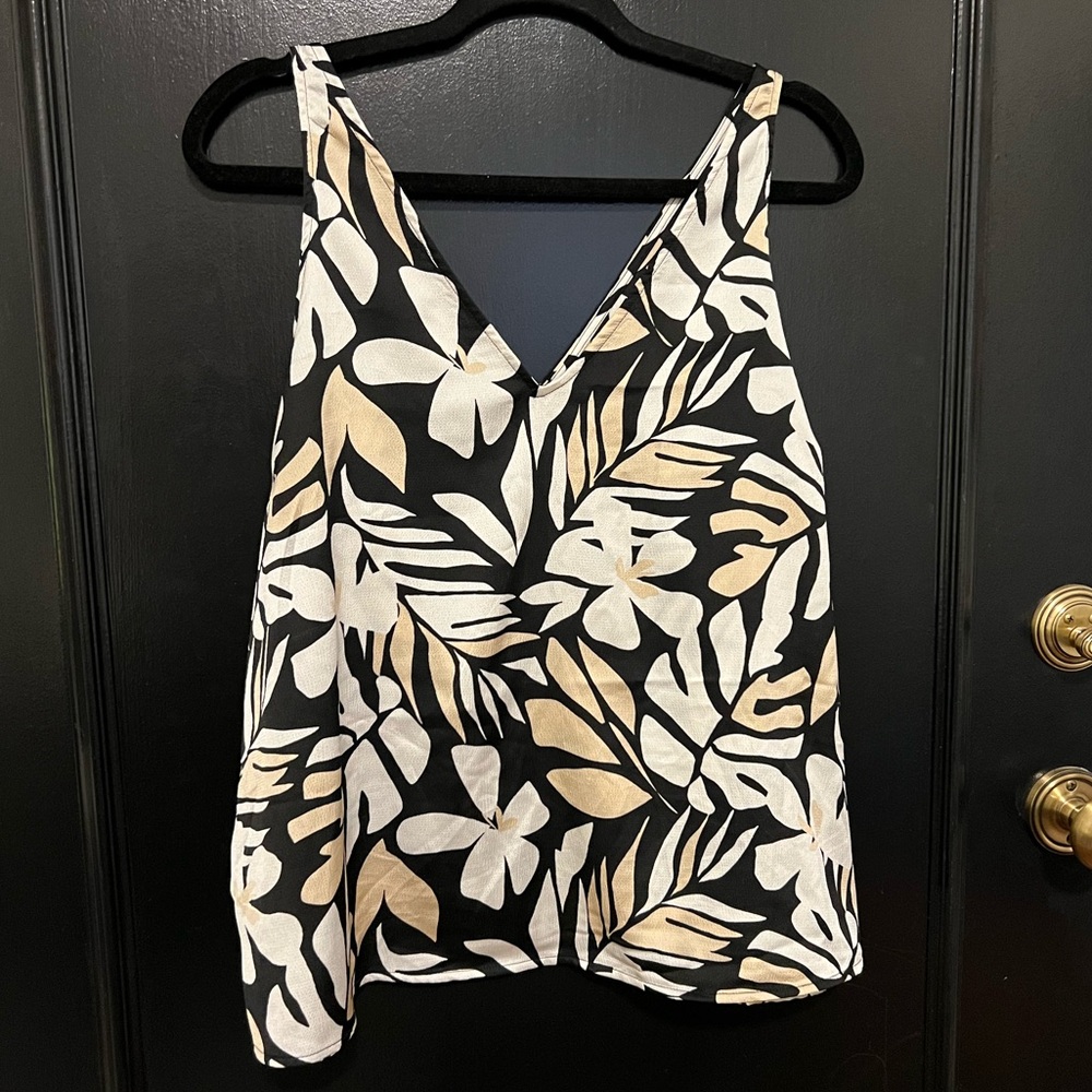 Sleeveless, floral top in neutral tones